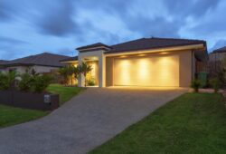 Well lit modern home exterior at dusk