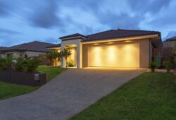 Well lit modern home exterior at dusk