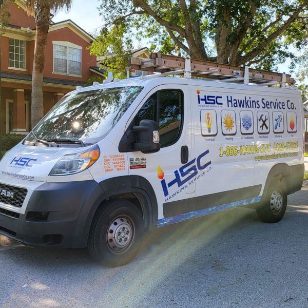 A Hawkins Service Company van parked outside a home