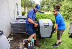 Two-Hawkins-Service-technicians-carrying-pool-equipment