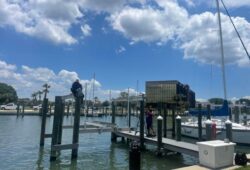 Two-people-working-on-boat-dock