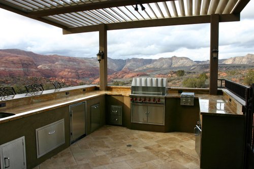 Outdoor kitchen and bar in backyard