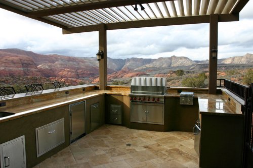 Outdoor kitchen and bar in backyard