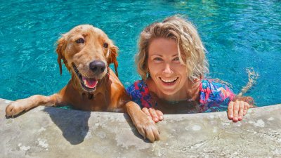 woman with a dog in pool