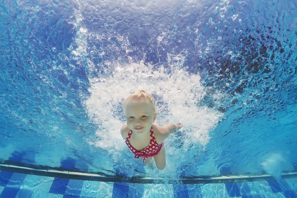 Child swimming under the water in Tampa, FL