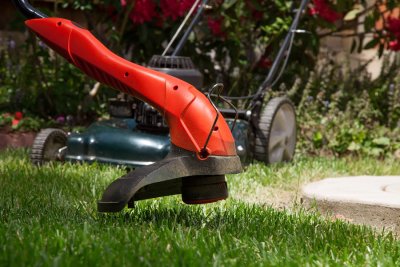 Weed wacker cutting grass