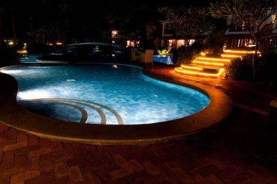 Luxury swimming pool with lighting in night at Tampa, FL