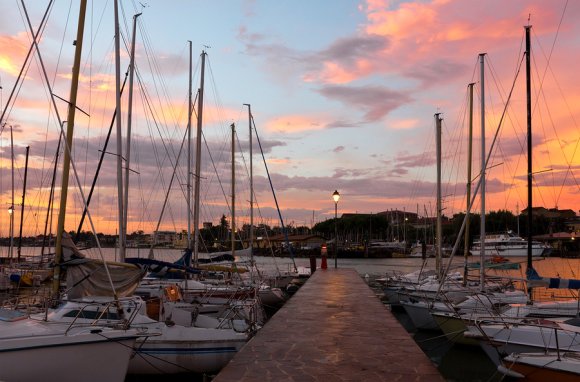 Boats are parked on the dock yard