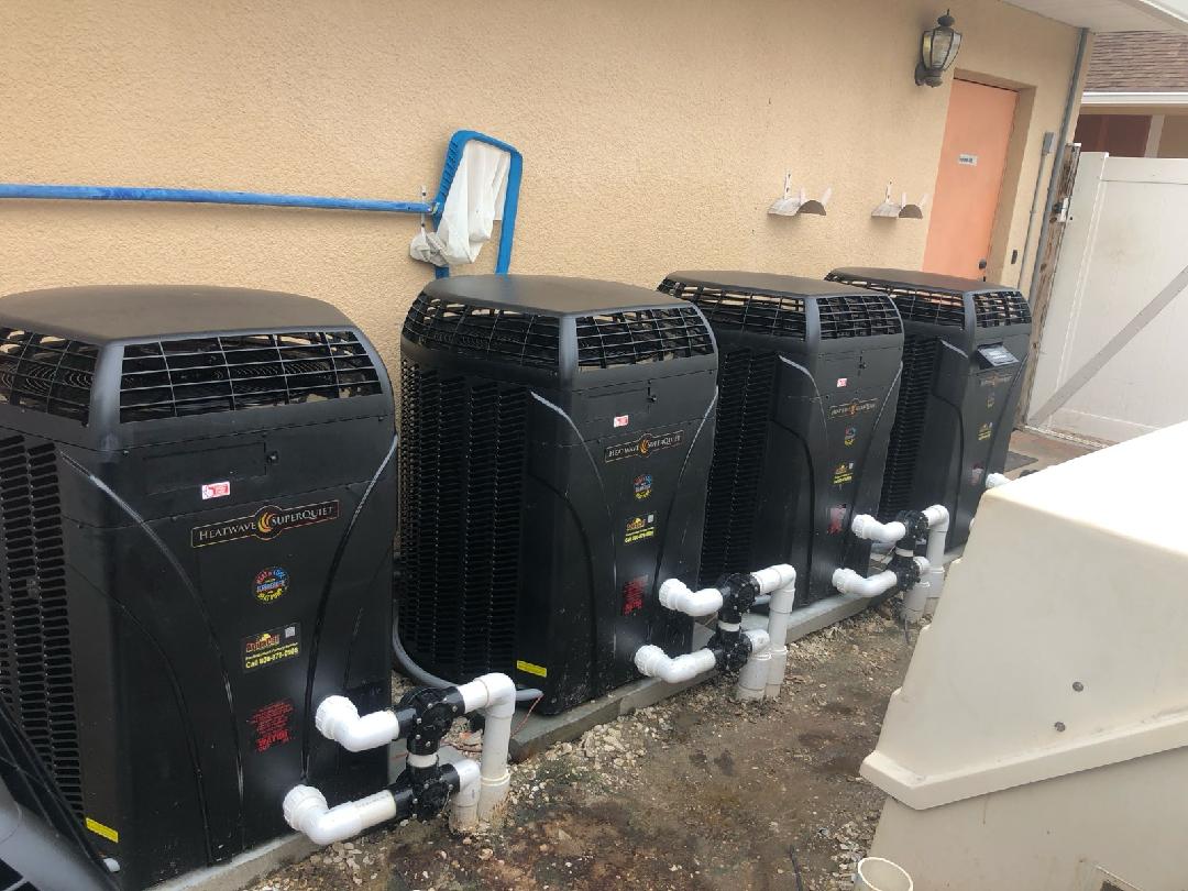row of four pool pumps