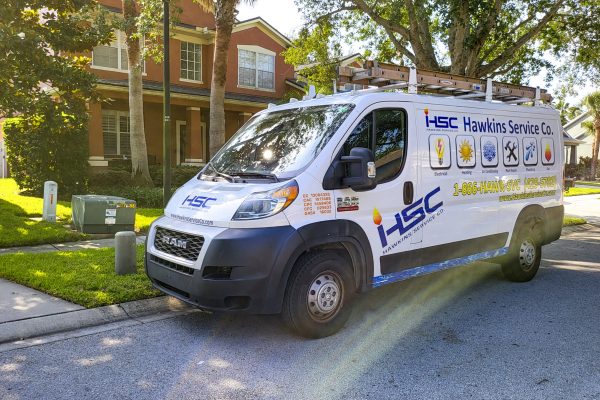 Company van parked in front of home