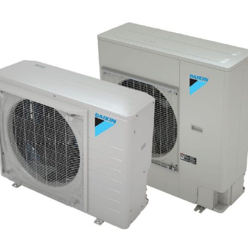 Two Daikin heat pumps layered with a white background