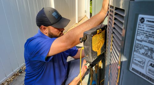 Hawkins AC technician outside
