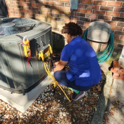 Hawkins-technician-working-on-AC-condenser