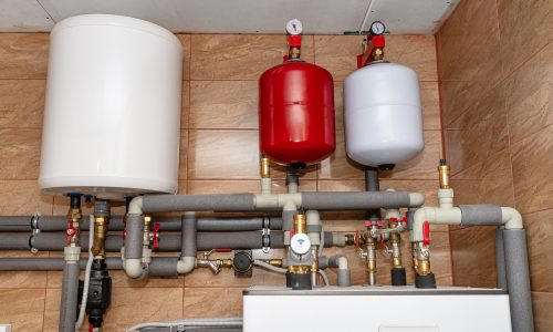 Expansion tank set up in a boiler room for a water heater system